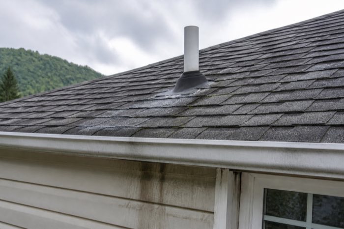 Water stains near roof flashing and gutters